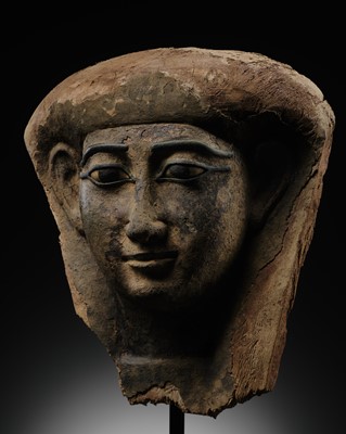 Lot 14 - A BRONZE AND LIMESTONE INLAID WOOD SARCOPHAGUS MASK, PTOLEMAIC PERIOD