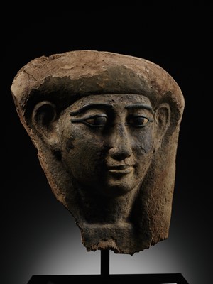 Lot 14 - A BRONZE AND LIMESTONE INLAID WOOD SARCOPHAGUS MASK, PTOLEMAIC PERIOD