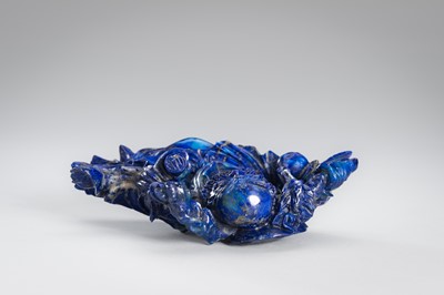 Lot 906 - A LAPIS LAZULI FIGURE OF AN IMMORTAL, c.1900s