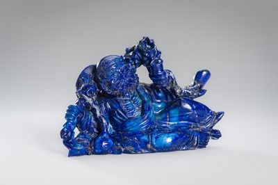 Lot 906 - A LAPIS LAZULI FIGURE OF AN IMMORTAL, c.1900s