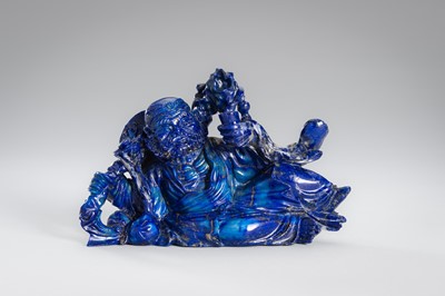 Lot 906 - A LAPIS LAZULI FIGURE OF AN IMMORTAL, c.1900s