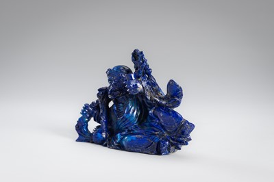 Lot 906 - A LAPIS LAZULI FIGURE OF AN IMMORTAL, c.1900s