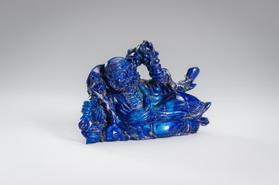 Lot 906 - A LAPIS LAZULI FIGURE OF AN IMMORTAL, c.1900s