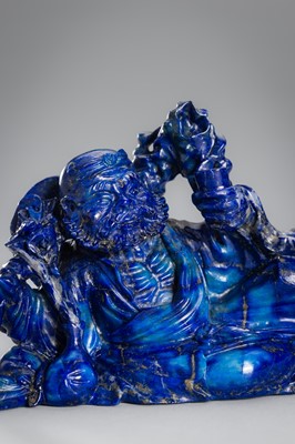 Lot 906 - A LAPIS LAZULI FIGURE OF AN IMMORTAL, c.1900s