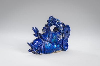 Lot 906 - A LAPIS LAZULI FIGURE OF AN IMMORTAL, c.1900s