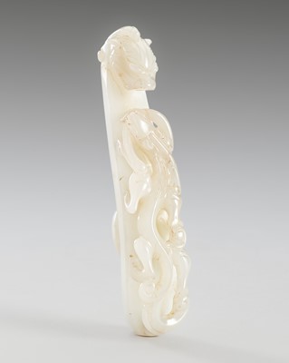 Lot 954 - A WHITE JADE ‘CHILONG’ BELT HOOK, 18TH-19TH CENTURY