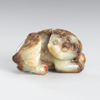 Lot 947 - A CELADON JADE CARVING OF A RECUMBENT MYTHICAL BEAST, QING DYNASTY