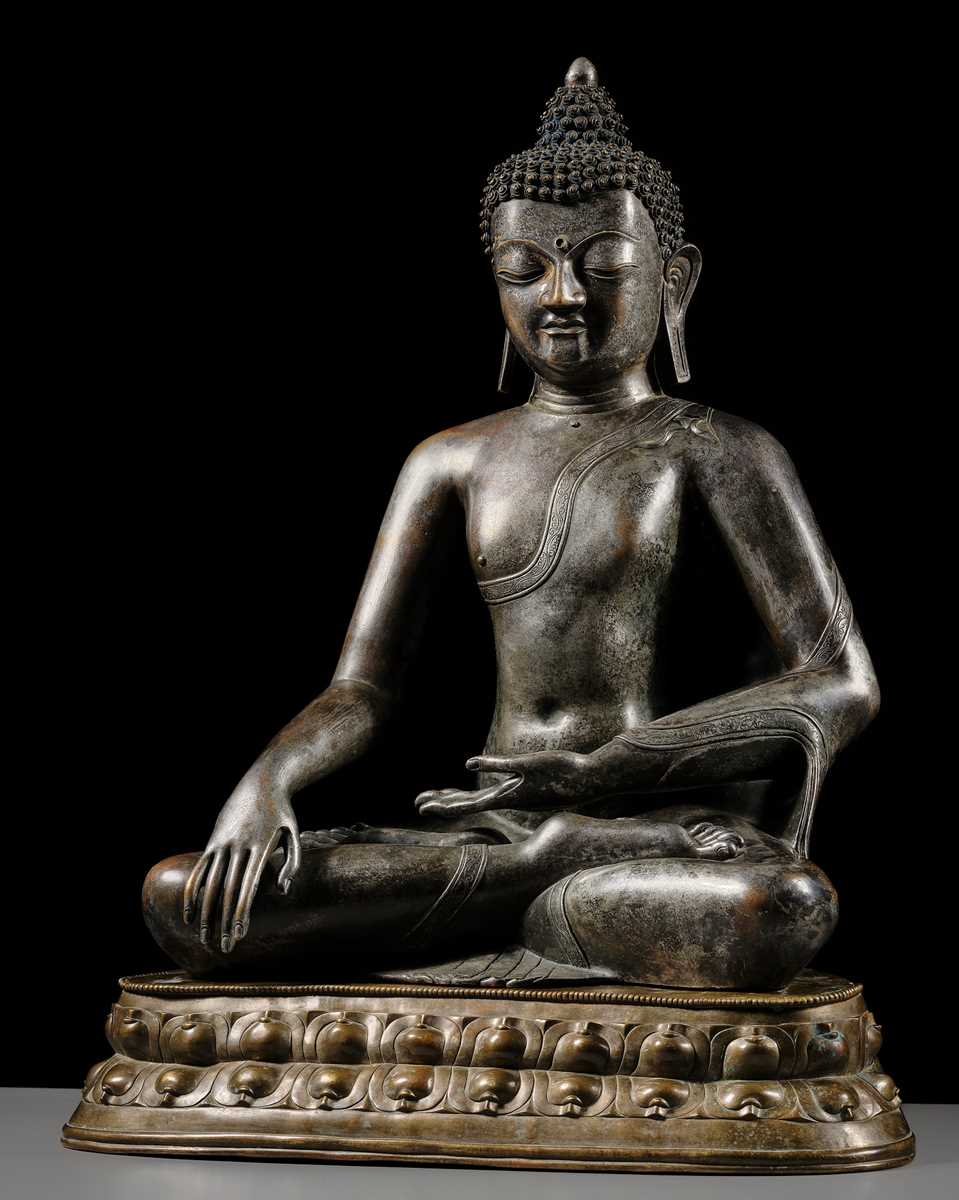 Lot 79 - A LARGE SILVERED BRONZE FIGURE OF BUDDHA SHAKYAMUNI, TIBETO-CHINESE, 15TH CENTURY, POSSIBLY IMPERIAL WORKSHOPS BEIJING