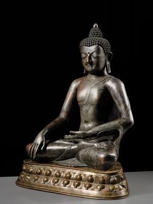 Lot 79 - A LARGE SILVERED BRONZE FIGURE OF BUDDHA SHAKYAMUNI, TIBETO-CHINESE, 15TH CENTURY, POSSIBLY IMPERIAL WORKSHOPS BEIJING