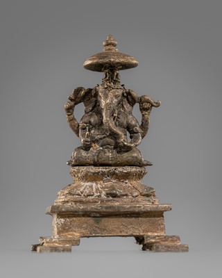A SMALL BRONZE FIGURE OF GANESHA, CENTRAL JAVA, 11TH CENTURY
