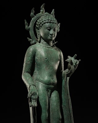 Lot 459 - AN IMPORTANT BRONZE FIGURE OF BUDDHA SHAKYAMUNI WITH A FLAMING AUREOLE, SRIVIJAYA EMPIRE, 7TH-8TH CENTURY