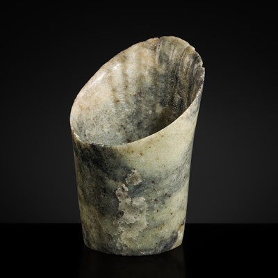 Lot 141 - A LARGE MOTTLED PALE CELADON JADE ‘HORSE-HOOF’ ORNAMENT, NEOLITHIC PERIOD, HONGSHAN CULTURE