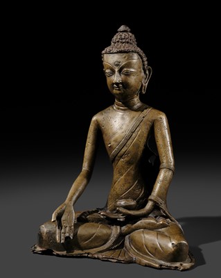 Lot 298 - A COPPER ALLOY FIGURE OF BUDDHA RATNASAMBHAVA, TIBET, CIRCA 12TH CENTURY