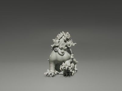 Lot 1584 - A CHARMING HIRADO WHITE-GLAZED OKIMONO OF A SHISHI