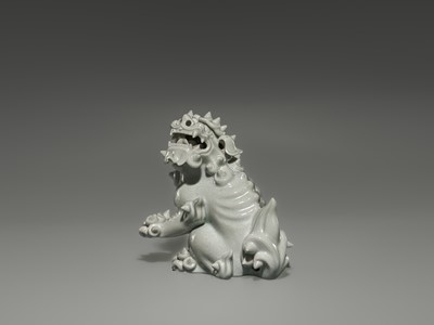 Lot 1584 - A CHARMING HIRADO WHITE-GLAZED OKIMONO OF A SHISHI