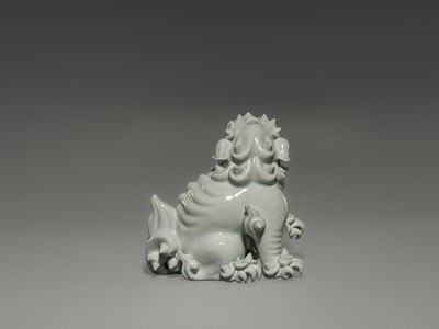 Lot 1584 - A CHARMING HIRADO WHITE-GLAZED OKIMONO OF A SHISHI