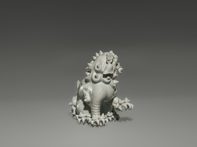 Lot 1584 - A CHARMING HIRADO WHITE-GLAZED OKIMONO OF A SHISHI