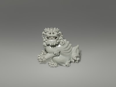 Lot 1584 - A CHARMING HIRADO WHITE-GLAZED OKIMONO OF A SHISHI