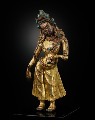 Lot 10 - A GILT-BRONZE FIGURE OF TARA, EARLY MALLA PERIOD, 1100 – 1382 AD