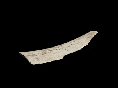 Lot 110 - AN INSCRIBED ORACLE BONE, SHANG DYNASTY