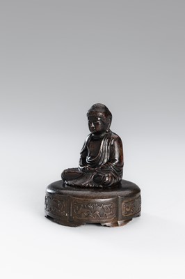 A SMALL COPPER ALLOY FIGURE OF BUDDHA