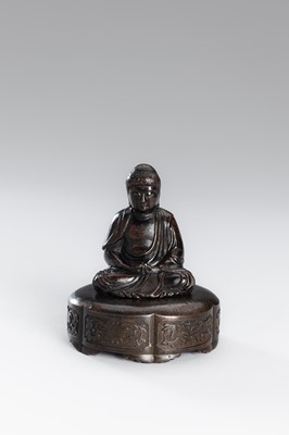 A SMALL COPPER ALLOY FIGURE OF BUDDHA