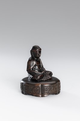 A SMALL COPPER ALLOY FIGURE OF BUDDHA