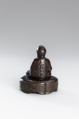 A SMALL COPPER ALLOY FIGURE OF BUDDHA