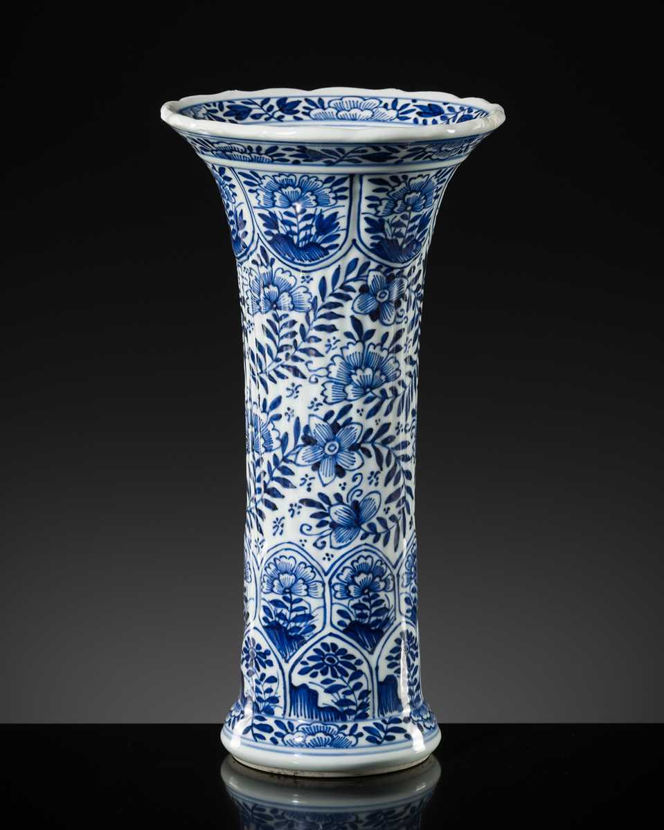 Lot 27 - A BLUE AND WHITE FLUTED AND MOLDED BEAKER VASE, KANGXI PERIOD
