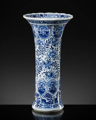 Lot 27 - A BLUE AND WHITE FLUTED AND MOLDED BEAKER VASE, KANGXI PERIOD