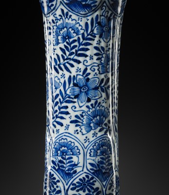 Lot 27 - A BLUE AND WHITE FLUTED AND MOLDED BEAKER VASE, KANGXI PERIOD