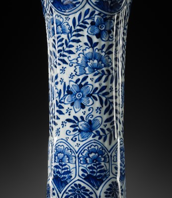 Lot 27 - A BLUE AND WHITE FLUTED AND MOLDED BEAKER VASE, KANGXI PERIOD