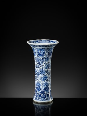 Lot 27 - A BLUE AND WHITE FLUTED AND MOLDED BEAKER VASE, KANGXI PERIOD