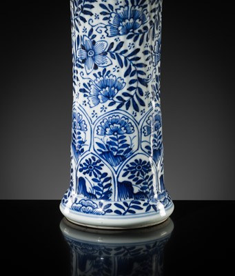 Lot 27 - A BLUE AND WHITE FLUTED AND MOLDED BEAKER VASE, KANGXI PERIOD