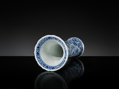 Lot 27 - A BLUE AND WHITE FLUTED AND MOLDED BEAKER VASE, KANGXI PERIOD