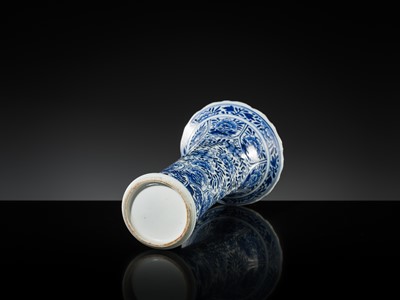 Lot 27 - A BLUE AND WHITE FLUTED AND MOLDED BEAKER VASE, KANGXI PERIOD