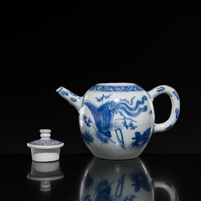 Lot 172 - A BLUE AND WHITE ‘QILIN AND PHOENIX’ TEAPOT AND COVER, TRANSITIONAL PERIOD, FROM THE HATCHER CARGO