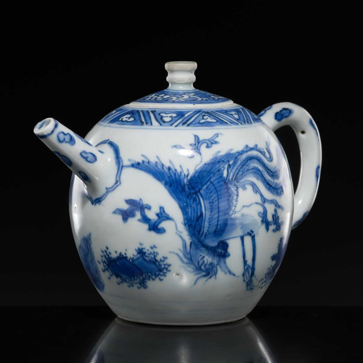 Lot 172 - A BLUE AND WHITE ‘QILIN AND PHOENIX’ TEAPOT AND COVER, TRANSITIONAL PERIOD, FROM THE HATCHER CARGO