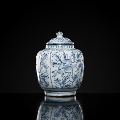 Lot 156 - A BLUE AND WHITE ‘FLORAL’ LOBED JAR AND COVER, WANLI PERIOD