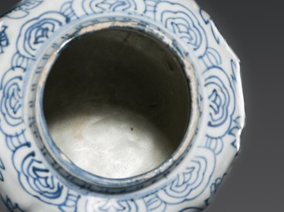 Lot 156 - A BLUE AND WHITE ‘FLORAL’ LOBED JAR AND COVER, WANLI PERIOD