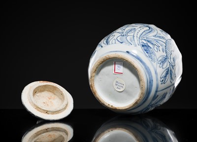 Lot 156 - A BLUE AND WHITE ‘FLORAL’ LOBED JAR AND COVER, WANLI PERIOD