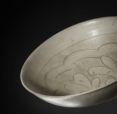 Lot 146 - A CARVED CIZHOU ‘LOTUS’ BOWL, NORTHERN SONG-YUAN DYNASTY