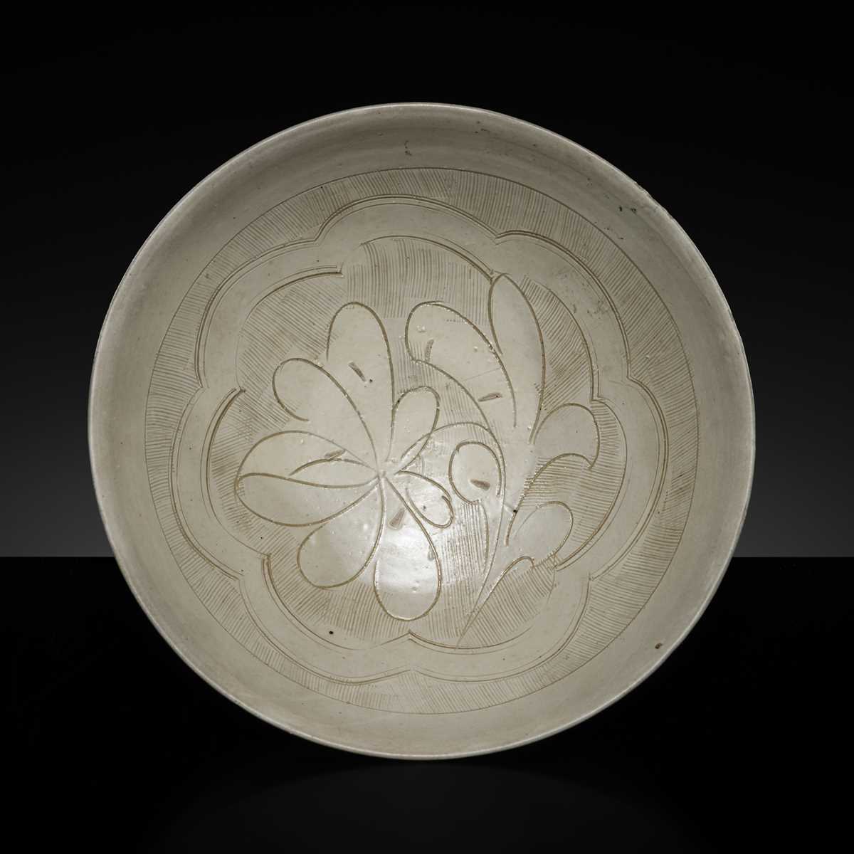 Lot 146 - A CARVED CIZHOU ‘LOTUS’ BOWL, NORTHERN SONG-YUAN DYNASTY