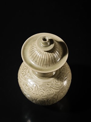 Lot 5 - A RARE CARVED LONGQUAN CELADON VASE AND COVER, NORTHERN SONG DYNASTY