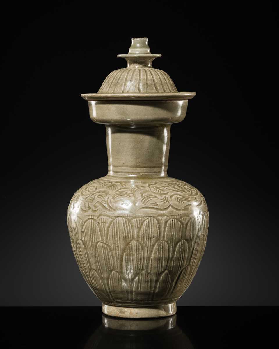 Lot 5 - A RARE CARVED LONGQUAN CELADON VASE AND COVER, NORTHERN SONG DYNASTY