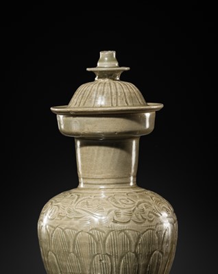 Lot 5 - A RARE CARVED LONGQUAN CELADON VASE AND COVER, NORTHERN SONG DYNASTY