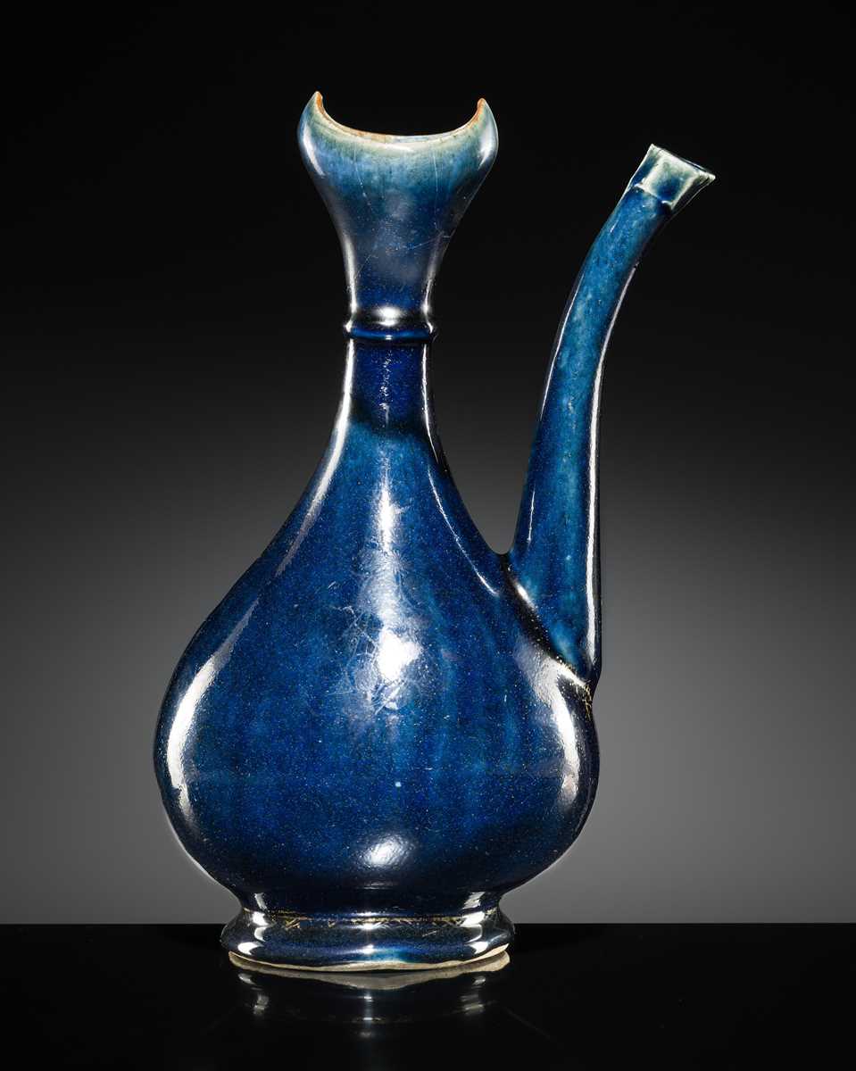 Lot 29 - A BLUE-GLAZED EWER FOR THE ISLAMIC MARKET, EARLY 18TH CENTURY