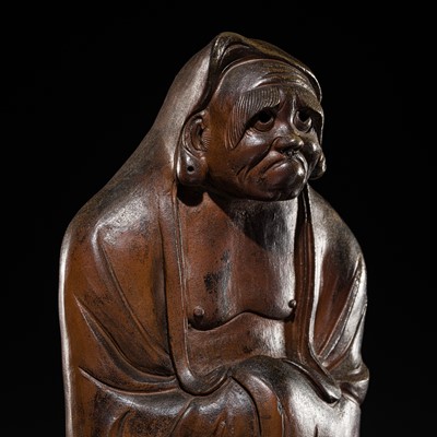 Lot 306 - A MASSIVE BROWN-GLAZED STONEWARE FIGURE OF DARUMA, EDO PERIOD