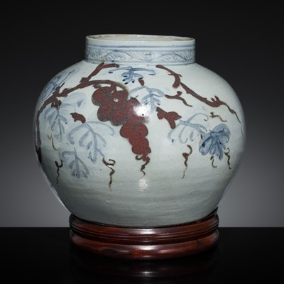 Lot 261 - A LARGE UNDERGLAZE-BLUE AND COPPER-RED-DECORATED ‘GRAPEVINES’ JAR, JOSEON DYNASTY