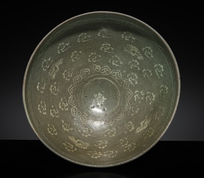 Lot 258 - A WHITE SLIP-INLAID CELADON STONEWARE BOWL WITH CRANES AND CLOUDS, GORYEO DYNASTY, LATE 13TH-14TH CENTURY